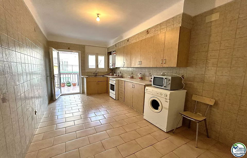 Flat situated in the centre of the village with large garage.